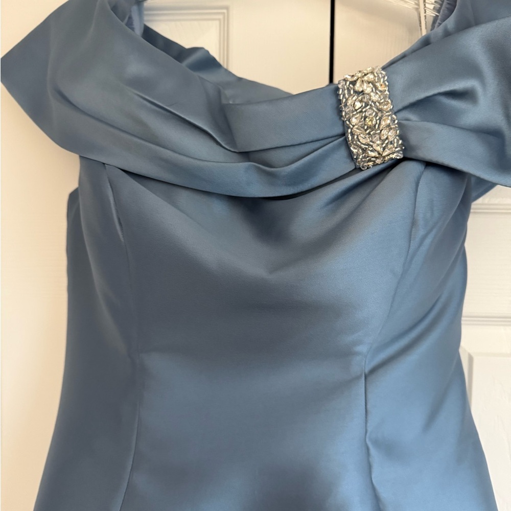 Sophisticated Satin Off-Shoulder Gown
Cameron Blake Evening Gown - Picture 2 of 5